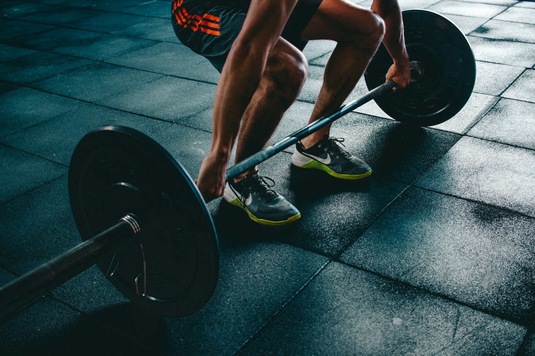 Loaded barbell on a gym floor