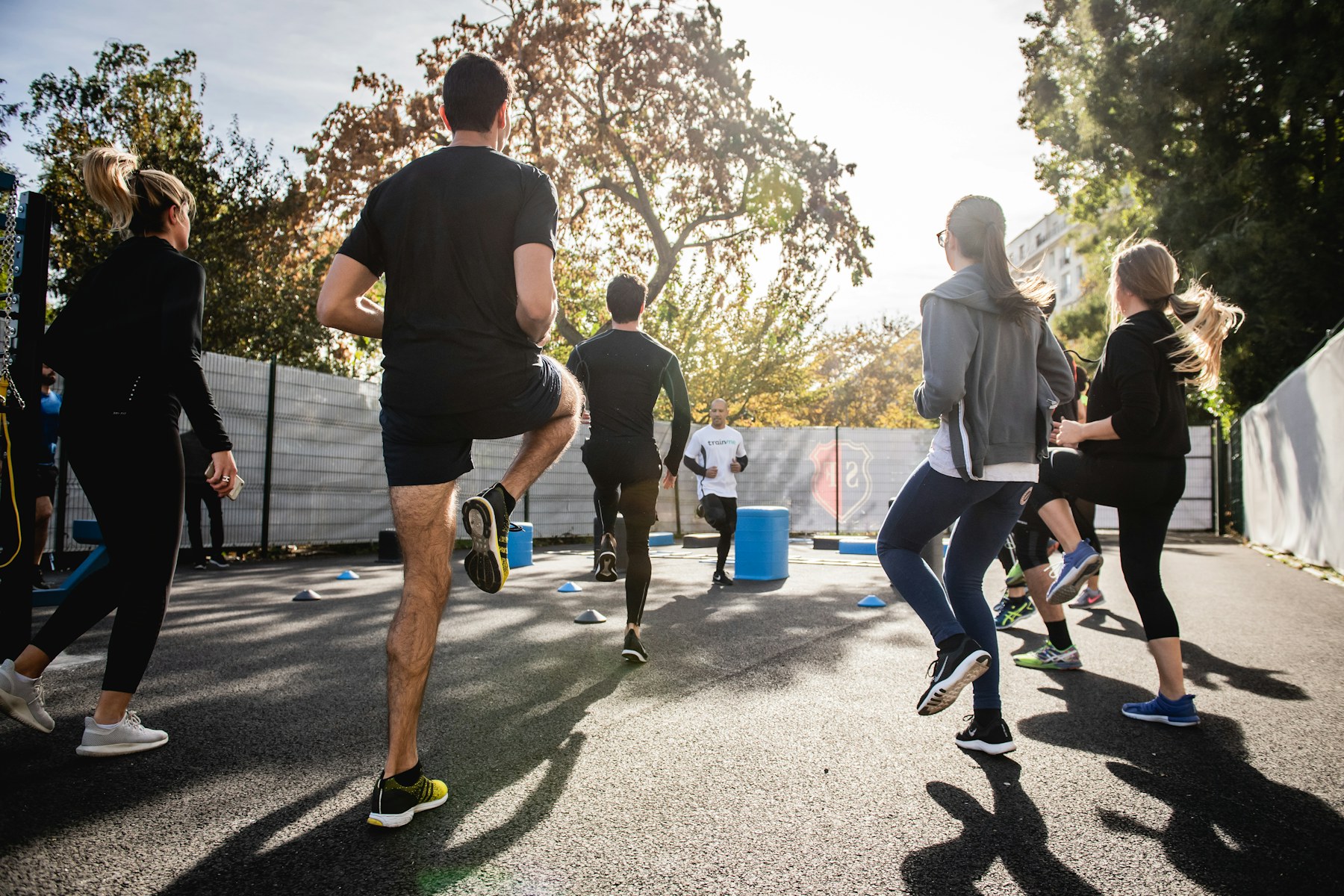 Group warming up outdoors before training